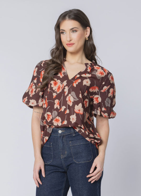 Soft cotton-blend fabric for comfort and breathability

Flattering V-neckline with frill detailing

3/4 puff sleeves for a feminine, stylish silhouette

Shaped back hem for a flattering finish

Ideal for seasonal transitions and everyday wear

Beautiful floral print for an elevated, timeless look