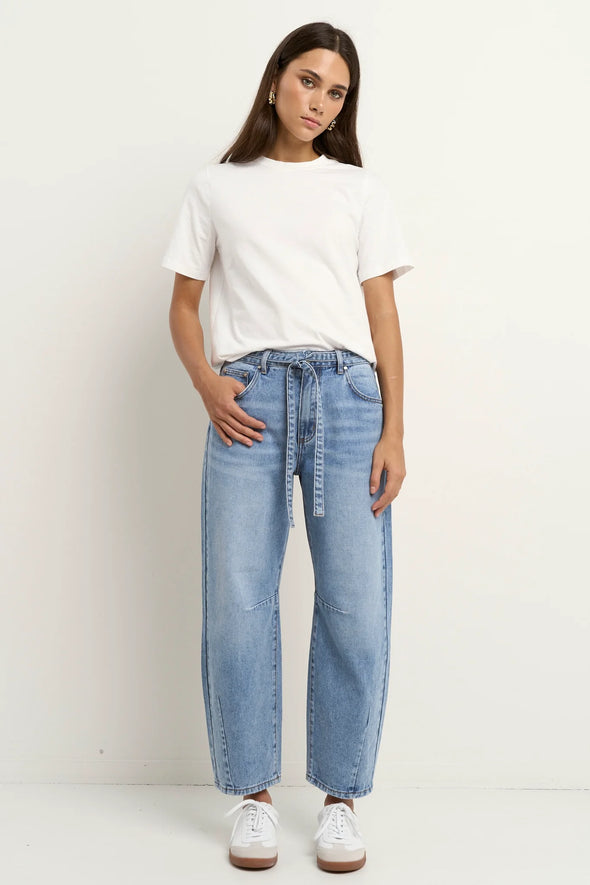 100% Cotton denim

High-rise fit for a flattering waistline

Barrel-leg cut for a relaxed, on-trend look

Soft light blue wash for everyday versatility

Self-tie waist belt for added shape and styling