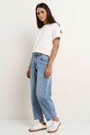100% Cotton denim

High-rise fit for a flattering waistline

Barrel-leg cut for a relaxed, on-trend look

Soft light blue wash for everyday versatility

Self-tie waist belt for added shape and styling