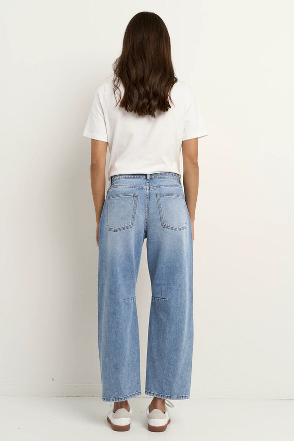 100% Cotton denim

High-rise fit for a flattering waistline

Barrel-leg cut for a relaxed, on-trend look

Soft light blue wash for everyday versatility

Self-tie waist belt for added shape and styling