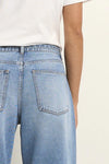 100% Cotton denim

High-rise fit for a flattering waistline

Barrel-leg cut for a relaxed, on-trend look

Soft light blue wash for everyday versatility

Self-tie waist belt for added shape and styling