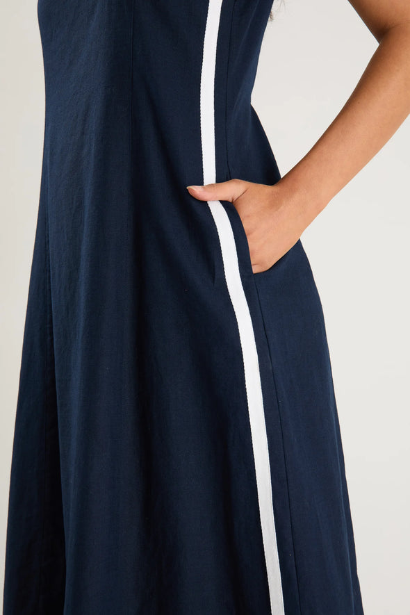 Crew neckline with a sleek sleeveless silhouette

Contrasting white side stripe for a modern statement

Midi length for a flattering, versatile fit

Easy to dress up or style casually

Fabric Composition: 55% Linen, 45% Cotton