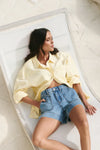 Oversized button-down shirt in pastel lemon

Lightweight cotton with a soft, crisp finish

Classic collared neckline with chest pocket

Wide cuffs and curved hem for a flattering shape

100% Cotton – breathable and easy to style

Wear tucked, tied, layered, or solo for versatile looks