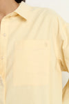 Oversized button-down shirt in pastel lemon

Lightweight cotton with a soft, crisp finish

Classic collared neckline with chest pocket

Wide cuffs and curved hem for a flattering shape

100% Cotton – breathable and easy to style

Wear tucked, tied, layered, or solo for versatile looks