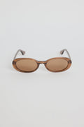 The Sydney Espresso Narrow Oval Sunglasses bring a sleek, retro-inspired touch to your everyday style. Designed in a warm espresso tone, this slim oval frame feels effortlessly cool with its lightweight, glossy finish. The soft brown lenses keep things understated and chic, making this pair an easy match for everything in your wardrobe.

A timeless, wear-anywhere accessory that adds instant polish.

- Recycled Acetate

- UV Protection Category 3