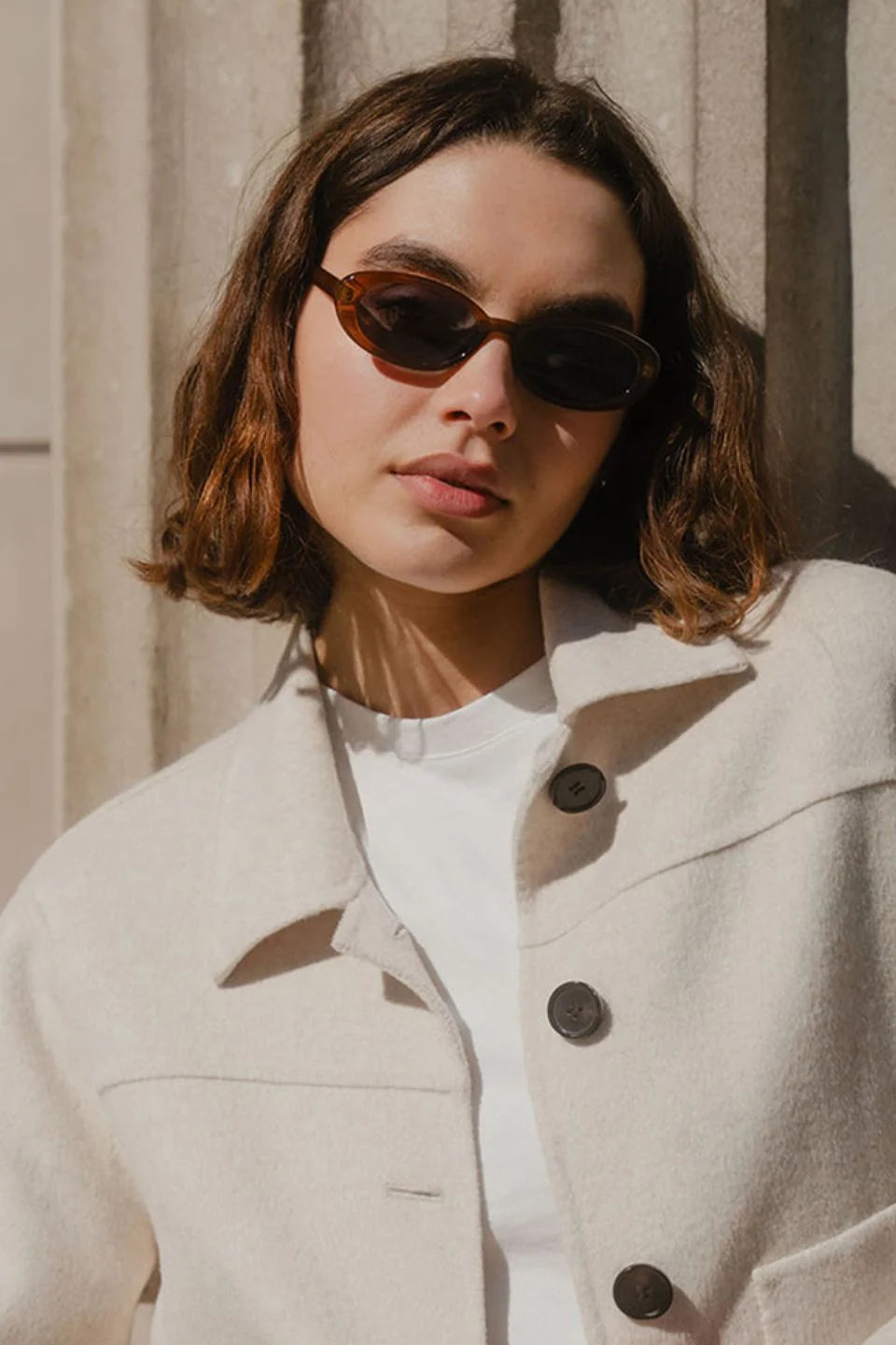 The Sydney Espresso Narrow Oval Sunglasses bring a sleek, retro-inspired touch to your everyday style. Designed in a warm espresso tone, this slim oval frame feels effortlessly cool with its lightweight, glossy finish. The soft brown lenses keep things understated and chic, making this pair an easy match for everything in your wardrobe.

A timeless, wear-anywhere accessory that adds instant polish.

- Recycled Acetate

- UV Protection Category 3