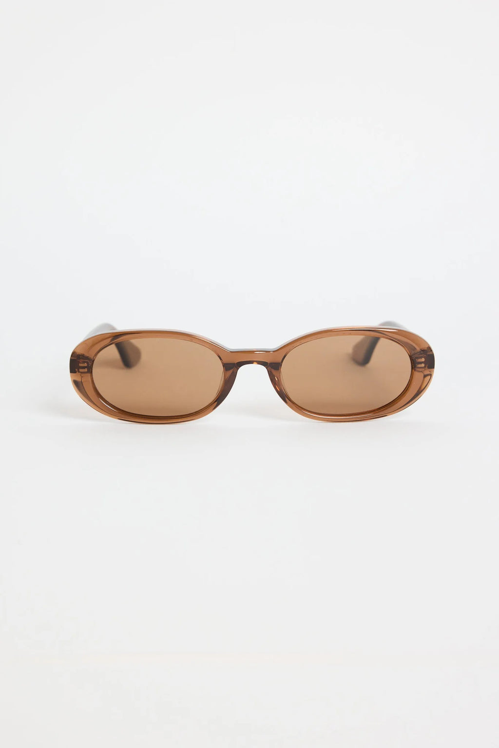The Sydney Espresso Narrow Oval Sunglasses bring a sleek, retro-inspired touch to your everyday style. Designed in a warm espresso tone, this slim oval frame feels effortlessly cool with its lightweight, glossy finish. The soft brown lenses keep things understated and chic, making this pair an easy match for everything in your wardrobe.

A timeless, wear-anywhere accessory that adds instant polish.

- Recycled Acetate

- UV Protection Category 3