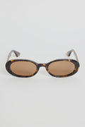 The Sydney Tort Narrow Oval Sunglasses bring a retro-cool finish to your everyday style. With a slim oval silhouette and a classic tortoiseshell frame, they strike that perfect mix of playful and polished. Warm brown lenses give them an easy, laidback feel that works with everything from casual tees to sun-ready dresses.

A chic little statement that instantly elevates your look

- Recycled Acetate

- UV Protection Category 3