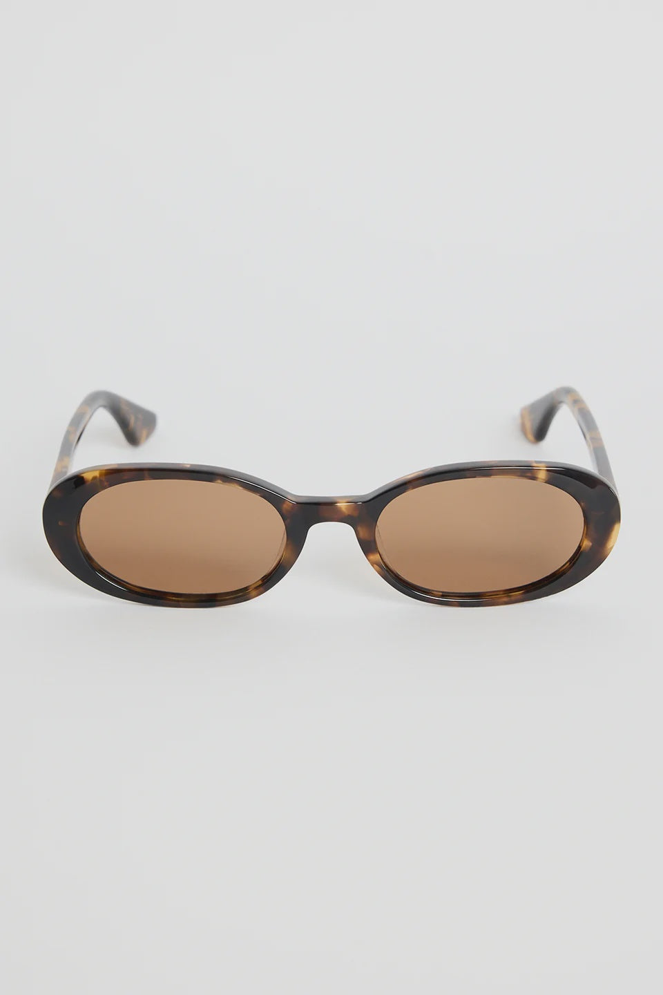 The Sydney Tort Narrow Oval Sunglasses bring a retro-cool finish to your everyday style. With a slim oval silhouette and a classic tortoiseshell frame, they strike that perfect mix of playful and polished. Warm brown lenses give them an easy, laidback feel that works with everything from casual tees to sun-ready dresses.

A chic little statement that instantly elevates your look

- Recycled Acetate

- UV Protection Category 3