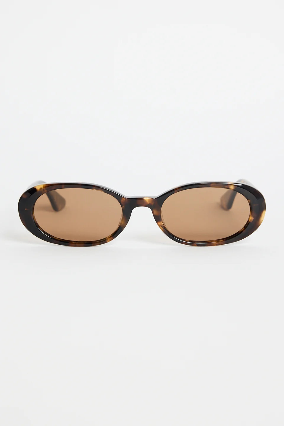 The Sydney Tort Narrow Oval Sunglasses bring a retro-cool finish to your everyday style. With a slim oval silhouette and a classic tortoiseshell frame, they strike that perfect mix of playful and polished. Warm brown lenses give them an easy, laidback feel that works with everything from casual tees to sun-ready dresses.

A chic little statement that instantly elevates your look

- Recycled Acetate

- UV Protection Category 3
