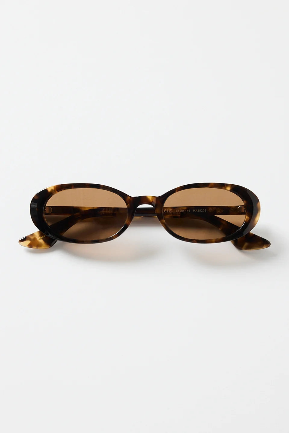 The Sydney Tort Narrow Oval Sunglasses bring a retro-cool finish to your everyday style. With a slim oval silhouette and a classic tortoiseshell frame, they strike that perfect mix of playful and polished. Warm brown lenses give them an easy, laidback feel that works with everything from casual tees to sun-ready dresses.

A chic little statement that instantly elevates your look

- Recycled Acetate

- UV Protection Category 3