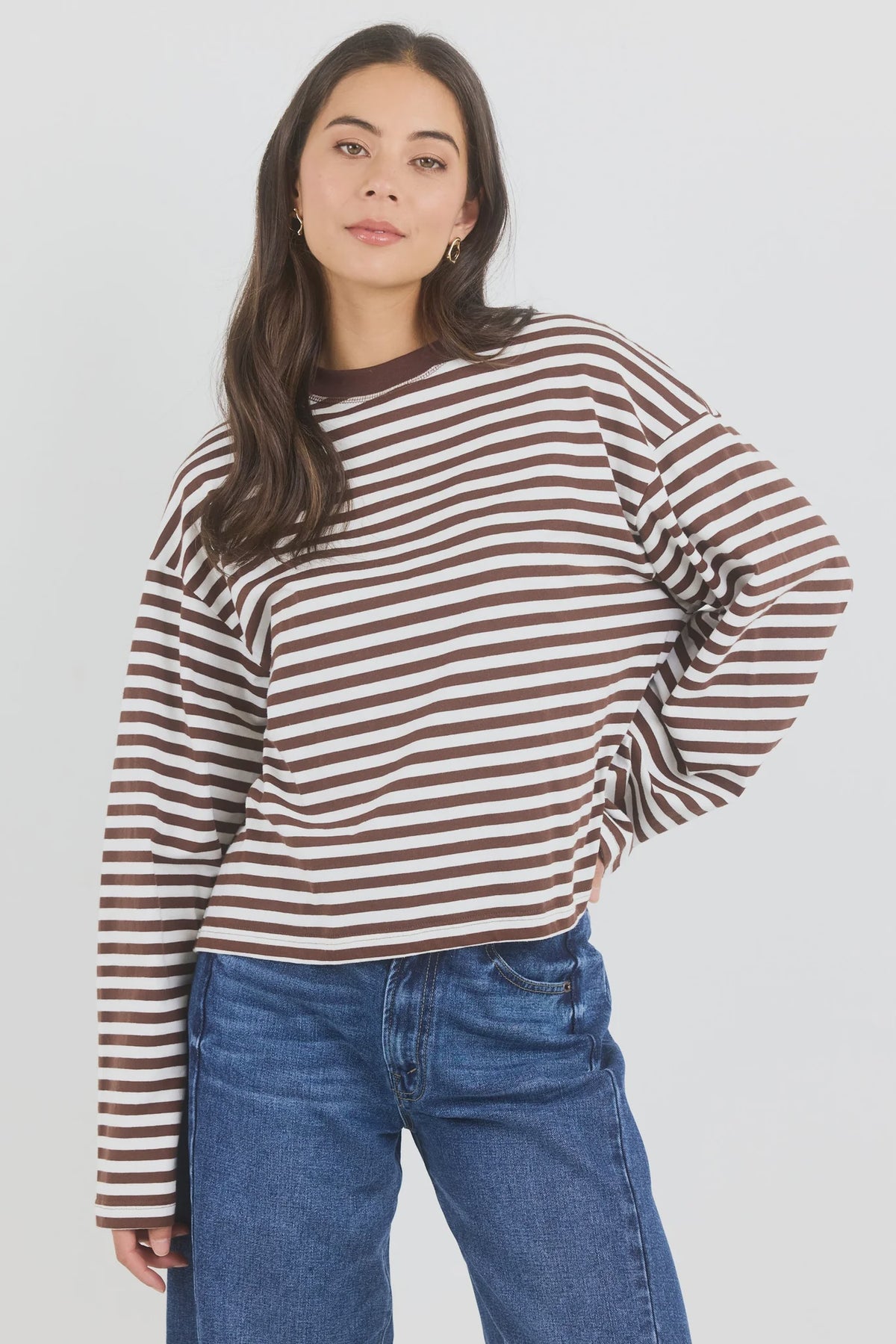 A classic stripe tee, the Unite Chocolate White Stripe Tee is an easy staple for everyday dressing. Designed with long sleeves, a crew neckline and an oversized boxy fit, it has a relaxed silhouette that feels effortless while still looking polished