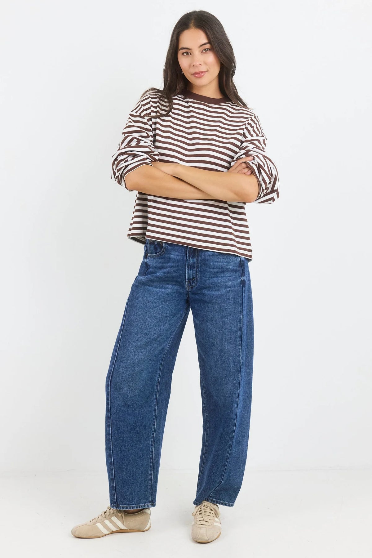 A classic stripe tee, the Unite Chocolate White Stripe Tee is an easy staple for everyday dressing. Designed with long sleeves, a crew neckline and an oversized boxy fit, it has a relaxed silhouette that feels effortless while still looking polished.