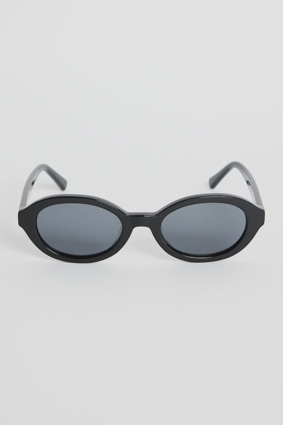 Sleek, minimal, and endlessly wearable, the Vienna Black Oval Sunglasses are your new go-to for everyday style. The smooth oval frame adds a modern twist to a classic shape, while the deep black finish keeps things sharp and refined. Lightweight and easy to pair with any outfit, they bring that subtle cool-girl energy we all love.

An effortless staple that elevates every sunny-day look.

- Recycled Acetate

- UV Protection Category 3