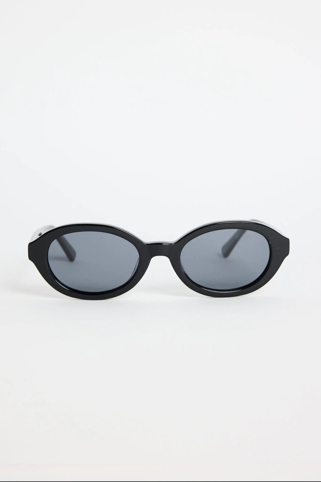 Sleek, minimal, and endlessly wearable, the Vienna Black Oval Sunglasses are your new go-to for everyday style. The smooth oval frame adds a modern twist to a classic shape, while the deep black finish keeps things sharp and refined. Lightweight and easy to pair with any outfit, they bring that subtle cool-girl energy we all love.

An effortless staple that elevates every sunny-day look.

- Recycled Acetate

- UV Protection Category 3