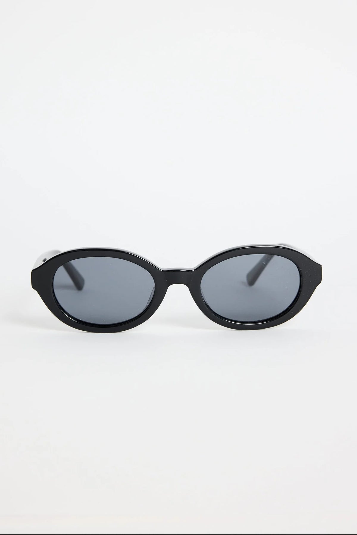 Sleek, minimal, and endlessly wearable, the Vienna Black Oval Sunglasses are your new go-to for everyday style. The smooth oval frame adds a modern twist to a classic shape, while the deep black finish keeps things sharp and refined. Lightweight and easy to pair with any outfit, they bring that subtle cool-girl energy we all love.

An effortless staple that elevates every sunny-day look.

- Recycled Acetate

- UV Protection Category 3
