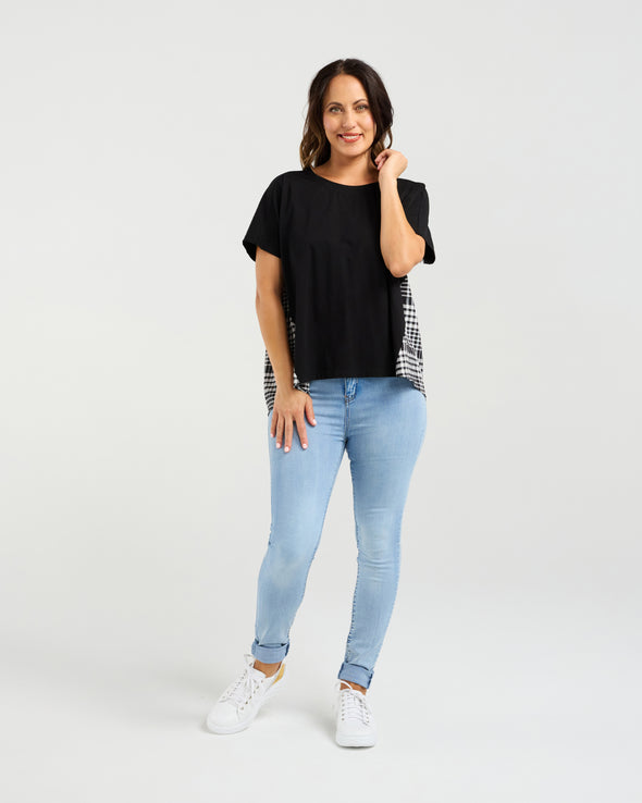 Relaxed, flowy fit for all-day comfort

Short sleeves with a flattering silhouette

Black front with contrasting check back detail

Longer back hem for added shape and interest

Easy to style for casual or dressy occasions

Body: 95% Cotton 5% Spandex&nbsp;
Back: 55% Polyester 45% Rayon