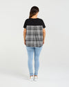 Relaxed, flowy fit for all-day comfort

Short sleeves with a flattering silhouette

Black front with contrasting check back detail

Longer back hem for added shape and interest

Easy to style for casual or dressy occasions

Body: 95% Cotton 5% Spandex
Back: 55% Polyester 45% Rayon