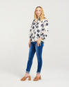 Classic button-down shirt design

Collar neckline with scalloped trim

3/4 puff sleeves with elasticated cuffs

Delicate lace inserts for a feminine touch

Timeless and versatile style

100% Cotton