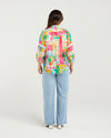 Bright Radiant print for a bold, modern look

Classic button-down style with collar neckline

3/4 puff sleeves with elasticated cuffs

Lace inserts and scalloped trim for feminine detail

Versatile shirt for work, weekends, or events

70% Rayon 30% Nylon