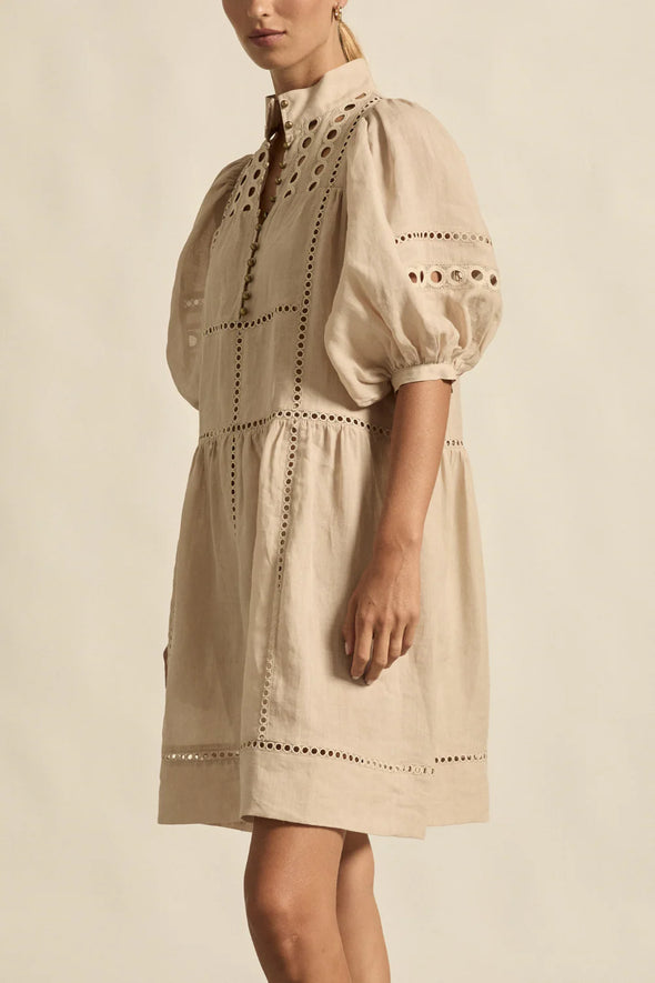100% ramie with cami slip included

Relaxed fit, designed to sit off the body

Drop waist silhouette for flattering ease

Elbow-length blouson sleeves for soft volume

High stand collar with antique brass button detailing