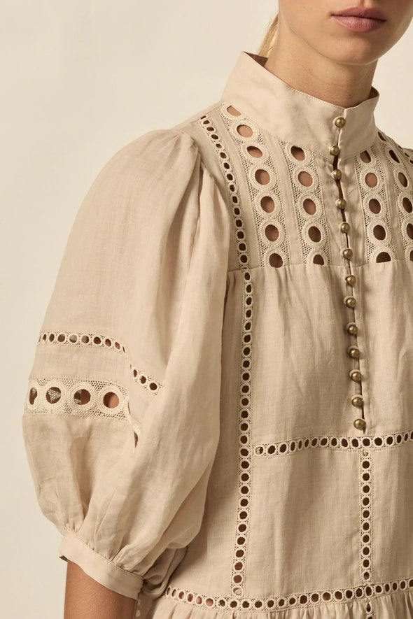 100% ramie with cami slip included

Relaxed fit, designed to sit off the body

Drop waist silhouette for flattering ease

Elbow-length blouson sleeves for soft volume

High stand collar with antique brass button detailing