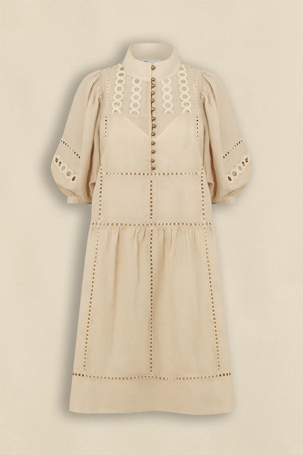 100% ramie with cami slip included

Relaxed fit, designed to sit off the body

Drop waist silhouette for flattering ease

Elbow-length blouson sleeves for soft volume

High stand collar with antique brass button detailing