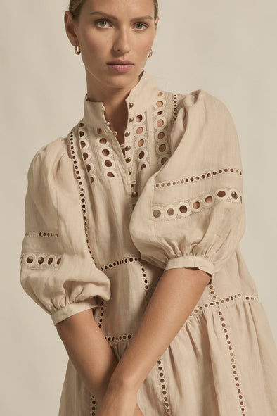 100% ramie with cami slip included

Relaxed fit, designed to sit off the body

Drop waist silhouette for flattering ease

Elbow-length blouson sleeves for soft volume

High stand collar with antique brass button detailing