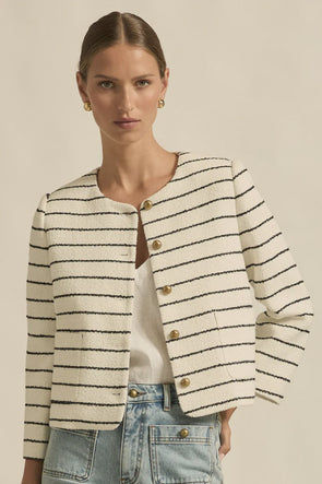 Crafted in 100% cotton

Fully lined in soft stretch fabric for all day comfort

Summer-weight boucle texture with a timeless feel

Round neckline and cropped silhouette for styling versatility

Brushed brass domed buttons for a refined accent

Rounded off front pockets that blend seamlessly into the boucle

Classic tailoring influence with a modern edge