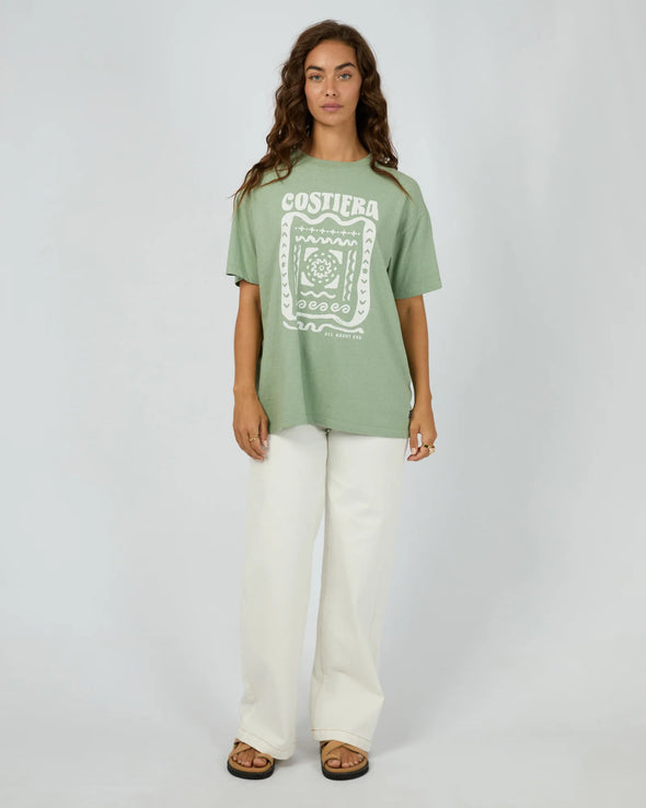 The Costiera Relaxed Tee in sage green brings easygoing style with a comfy, breathable fit that feels like a gentle breeze all day long. Its bold white hand-drawn print adds an artsy twist to a calm, neutral shade. Pair it with your fave high-waisted jeans or sharp shorts for a look that’s effortlessly cool—perfect for anything from coffee runs to evening hangs.