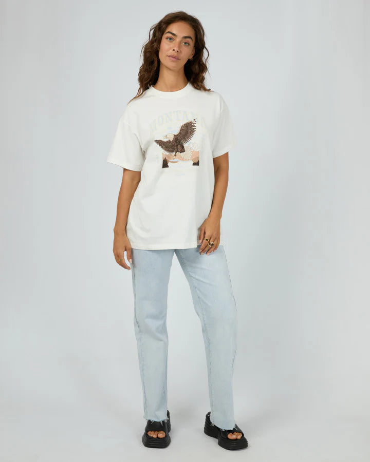 Stay cool and comfy in the All About Eve Montana Relaxed Tee, made from 100% soft cotton. With its easygoing fit and eye-catching graphic print, this tee brings laid-back vibes with a stylish twist—perfect for those days when you want to look effortlessly cool while keeping it casual.