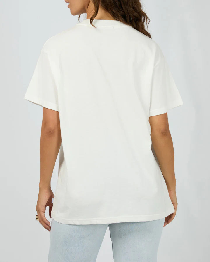 Stay cool and comfy in the All About Eve Montana Relaxed Tee, made from 100% soft cotton. With its easygoing fit and eye-catching graphic print, this tee brings laid-back vibes with a stylish twist—perfect for those days when you want to look effortlessly cool while keeping it casual.