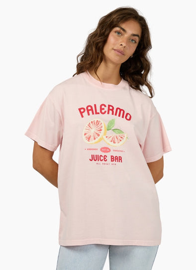 The Palermo Relaxed Tee adds a bold splash of fun to your wardrobe with its vibrant pink base, eye-catching red text, and a playful grapefruit graphic that brings a fresh, zesty vibe. Crafted from soft 100% cotton with a relaxed fit and crew neckline, it’s perfect for effortless everyday style. Pair it with your favorite denim or wide-leg pants for a standout, comfortable look that’s ready to brighten any day.