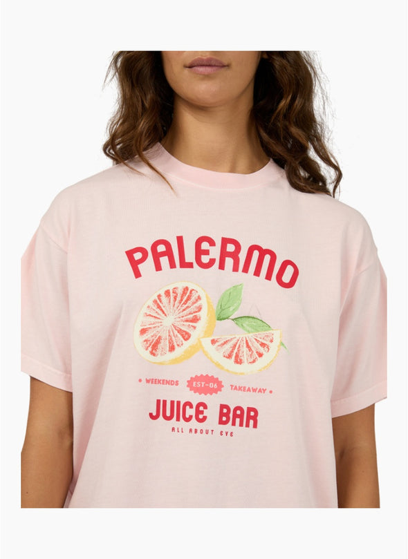 The Palermo Relaxed Tee adds a bold splash of fun to your wardrobe with its vibrant pink base, eye-catching red text, and a playful grapefruit graphic that brings a fresh, zesty vibe. Crafted from soft 100% cotton with a relaxed fit and crew neckline, it’s perfect for effortless everyday style. Pair it with your favorite denim or wide-leg pants for a standout, comfortable look that’s ready to brighten any day.