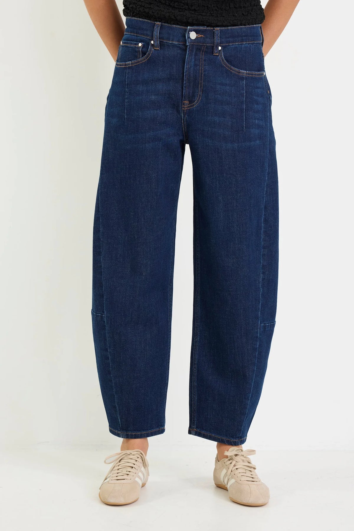 Meet your new everyday denim favourite. The Graduate Dark Blue Wide Leg Jean is designed with a flattering mid-rise waist and an effortlessly chic wide-leg silhouette that's made for every occasion. Crafted from comfort stretch denim, it offers the perfect balance of structure and flexibility, holding its shape while moving with you. Easy to dress up or down, it's the pair you'll keep reaching for season after season.