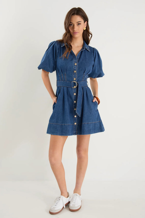 - Statement puff sleeves for a bold yet feminine look
- Button-down front for a classic touch
- Adjustable waist belt for a flattering, cinched silhouette
- Crafted from soft indigo denim with contrast stitching
- Fabric Composition - 80% Cotton 20% Polyester