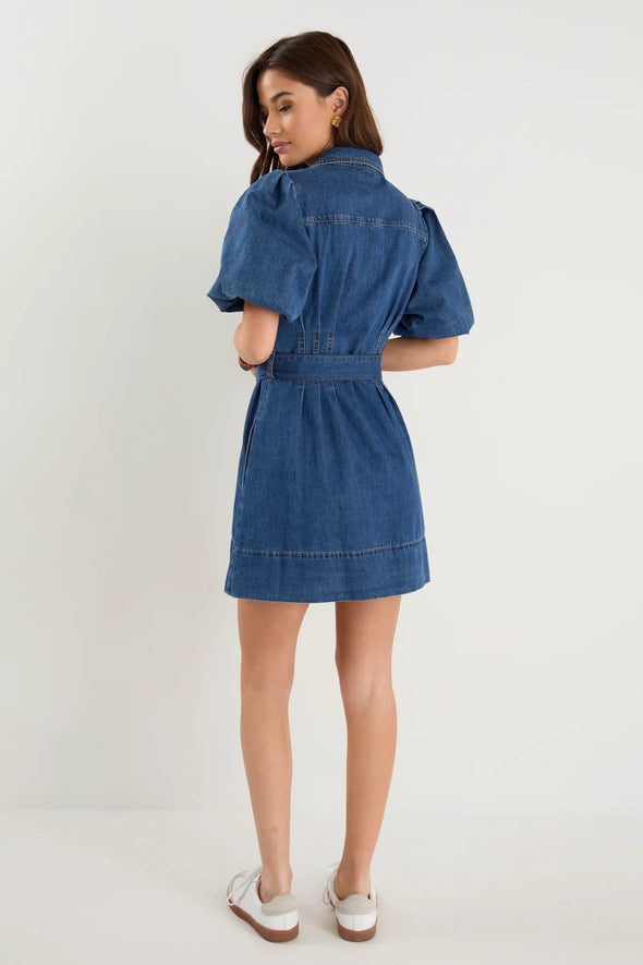 - Statement puff sleeves for a bold yet feminine look
- Button-down front for a classic touch
- Adjustable waist belt for a flattering, cinched silhouette
- Crafted from soft indigo denim with contrast stitching
- Fabric Composition - 80% Cotton 20% Polyester