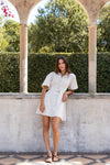 - Statement puff sleeves for a bold yet feminine look
- Button-down front for a classic touch
- Adjustable waist belt for a flattering, cinched silhouette
- Crafted from soft ecru denim with contrast stitching