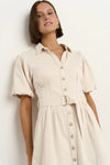 - Statement puff sleeves for a bold yet feminine look
- Button-down front for a classic touch
- Adjustable waist belt for a flattering, cinched silhouette
- Crafted from soft ecru denim with contrast stitching