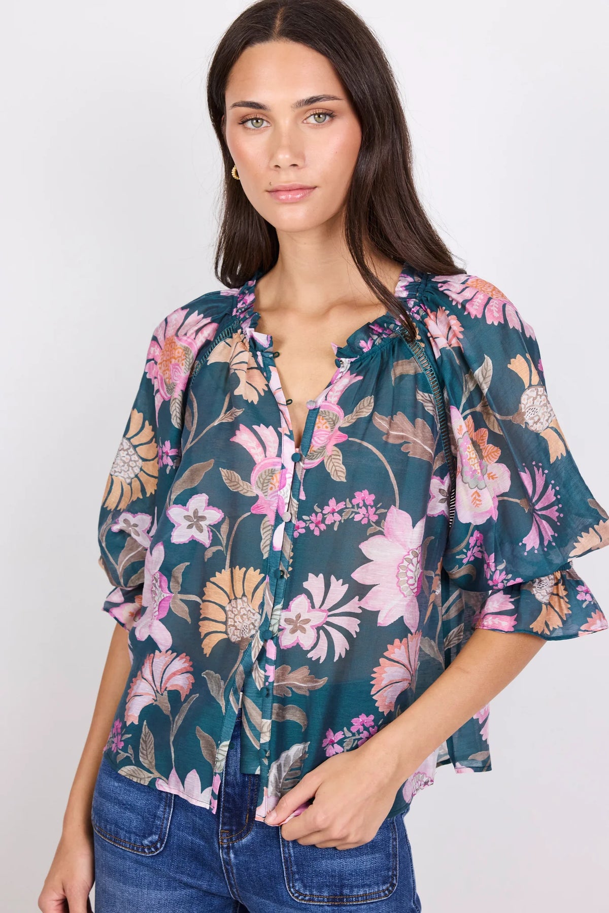 Soft floral scarf print
Rich petrol colourway
Relaxed floaty silhouette
Short balloon sleeves
Button front fastening
Lightweight linen blend fabric
Easy to dress up or down