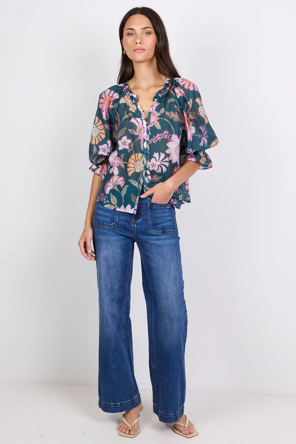 Soft floral scarf print
Rich petrol colourway
Relaxed floaty silhouette
Short balloon sleeves
Button front fastening
Lightweight linen blend fabric
Easy to dress up or down