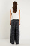 The Clever Black Lines Drawcord Wide Leg Pants offer a relaxed yet refined look with their subtle line print and wide-leg silhouette. Featuring a high-rise fit and adjustable drawcord waist, these trousers provide a flattering and customizable shape. Crafted from a lightweight fabric blend, they ensure breathable comfort from daytime meetings to evening outings.