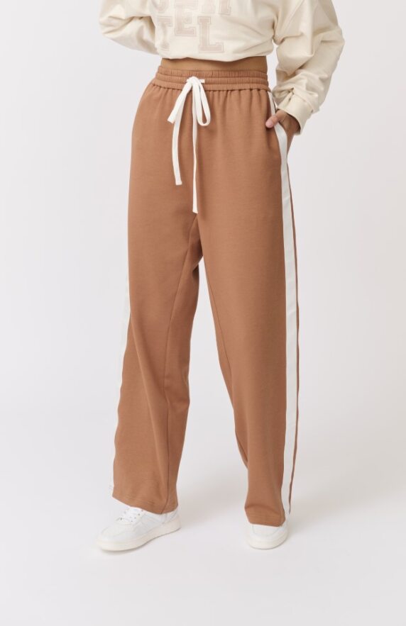 The most epic upstyled trackpant you will ever find. Toffee colour with double white side stripe and draw string waist. true to size and limited stock