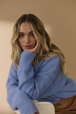 a beautiful V neck fluffy jumper, with luxury ripped detail and relaxed style. the softest periwinkle colour.
