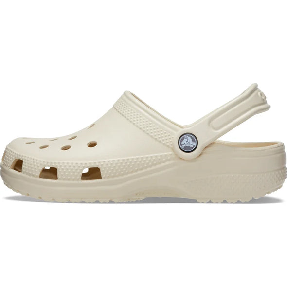 Original. Versatile. Comfortable. It’s the iconic clog that started a comfort revolution around the world! The go-to comfort shoe that you're sure to fall deeper in love with day after day. Crocs Classic Clogs offer lightweight Iconic Crocs Comfort™, a color for every personality, and an ongoing invitation to be comfortable in your own shoes. The Classic clog in Bone Colour