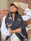 Luxury at the ready. Add that touch of something truly special to your outfit with a Dark Hampton scarf. Whether you are rugging up against the winter breeze or adding texture, layers or colour to your look - Dark Hampton will do it all.  Jacquard scarf  Dimensions: 210cm x 50cm  Our blanket scarves are big and luxurious and they make the perfect scarf, wrap&nbsp;or shawl.&nbsp;  The Ferguson is a classic combination of black and tan, it is timeless and sophisticated.