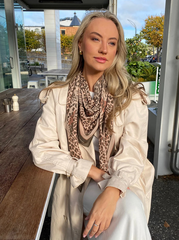 Luxury at the ready. Add that touch of something truly special to your outfit with a Dark Hampton scarf. Whether you are rugging up against the winter breeze or adding texture, layers or colour to your look - Dark Hampton will do it all. 90% Modal, 10% Cashmere. Lightweight and soft feel.&nbsp; Dimensions are 120x120cm An elegant take on the traditional leopard print. A beautiful brown and beige colour combination.