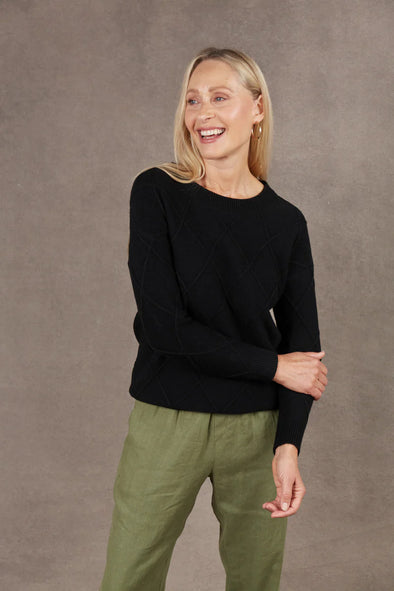 Introducing the Nakako Jumper - your new go-to everyday knit. The classic silhouette is elevated by a knitted argyle design, adding depth to your outfit. Whether you're spending the day relaxing at home or exploring the town, this versatile knit effortlessly suits every occasion. Pair it with a maxi skirt and sneakers, and don't forget to add a stylish scarf to complete the look.