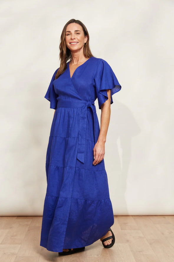 Prepare to RSVP "yes" to every event with the Halcyon Maxi Dress! A standout style in luscious linen, this maxi will be your pick for all your summer festivities. This stunning wrap dress features flutter sleeves, a self-fabric tie, and delicate tiers for that extra touch of charm. Whether you're heading to a garden party or a beach wedding, pair this maxi with sandals or wedges for an ensemble that's sure to turn heads!