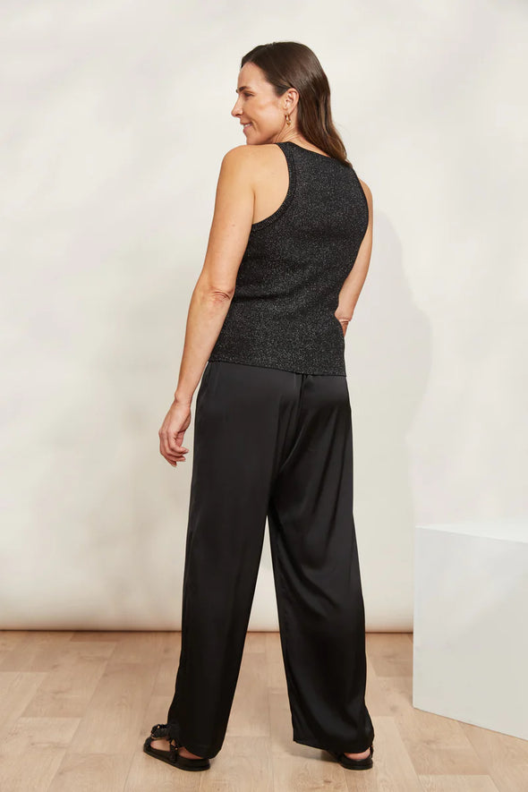 Take your casual wardrobe to the next level with the Lujo Tank. It features a round neck and sleeveless design in a fitted rib-knit that's both comfy and stylish. But here's the best part: it's threaded with shimmering lurex that catches the light and adds a touch of sparkle to your look! Wear it as it is with shorts and slides during warmer days, or layer it with an open button-down shirt and loose pants for an effortless transeasonal look.